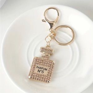 Perfume bottle rhinestone keychain.